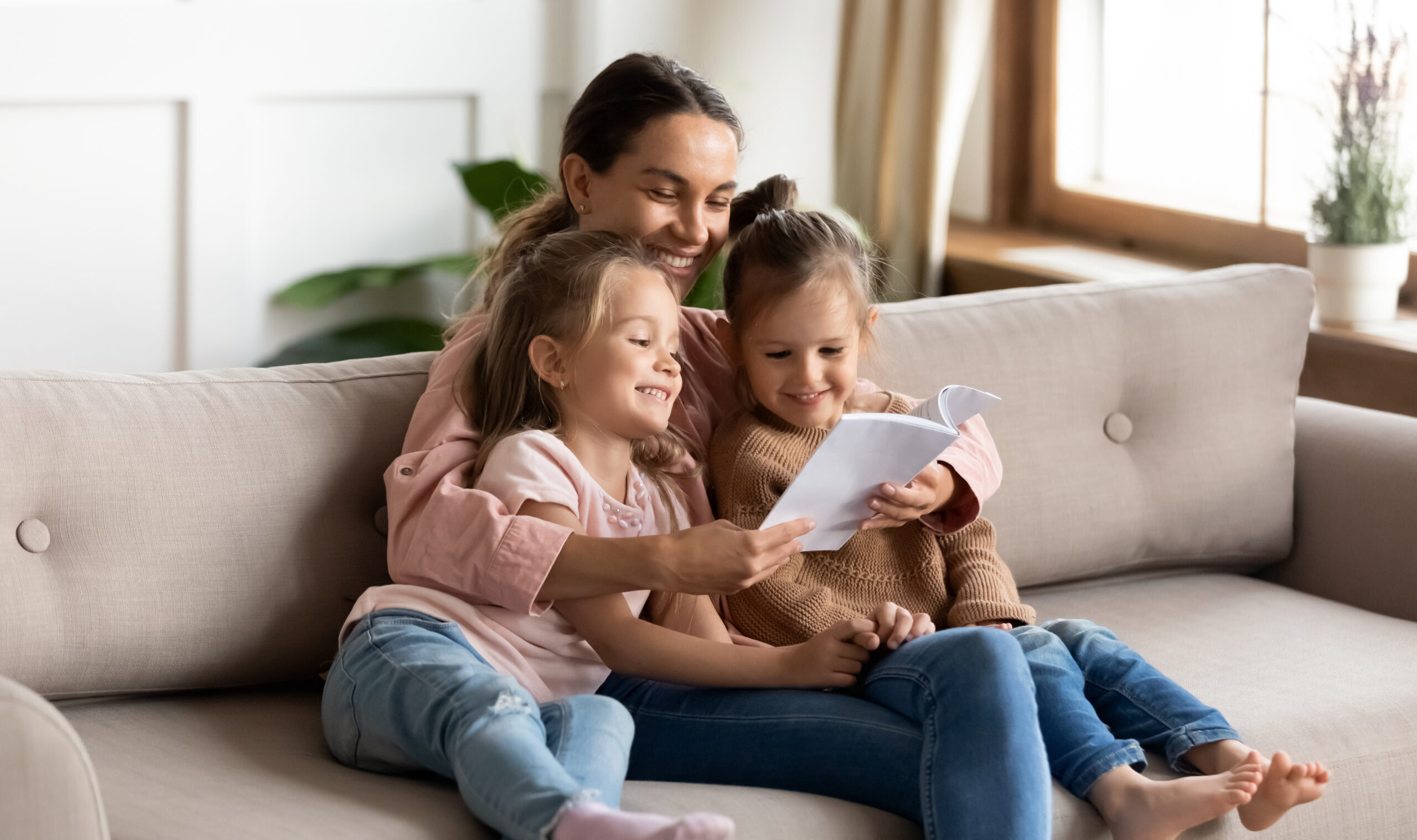 Happy,Family,Young,Mother,Babysitter,Hold,Read,Book,Relax,Embrace