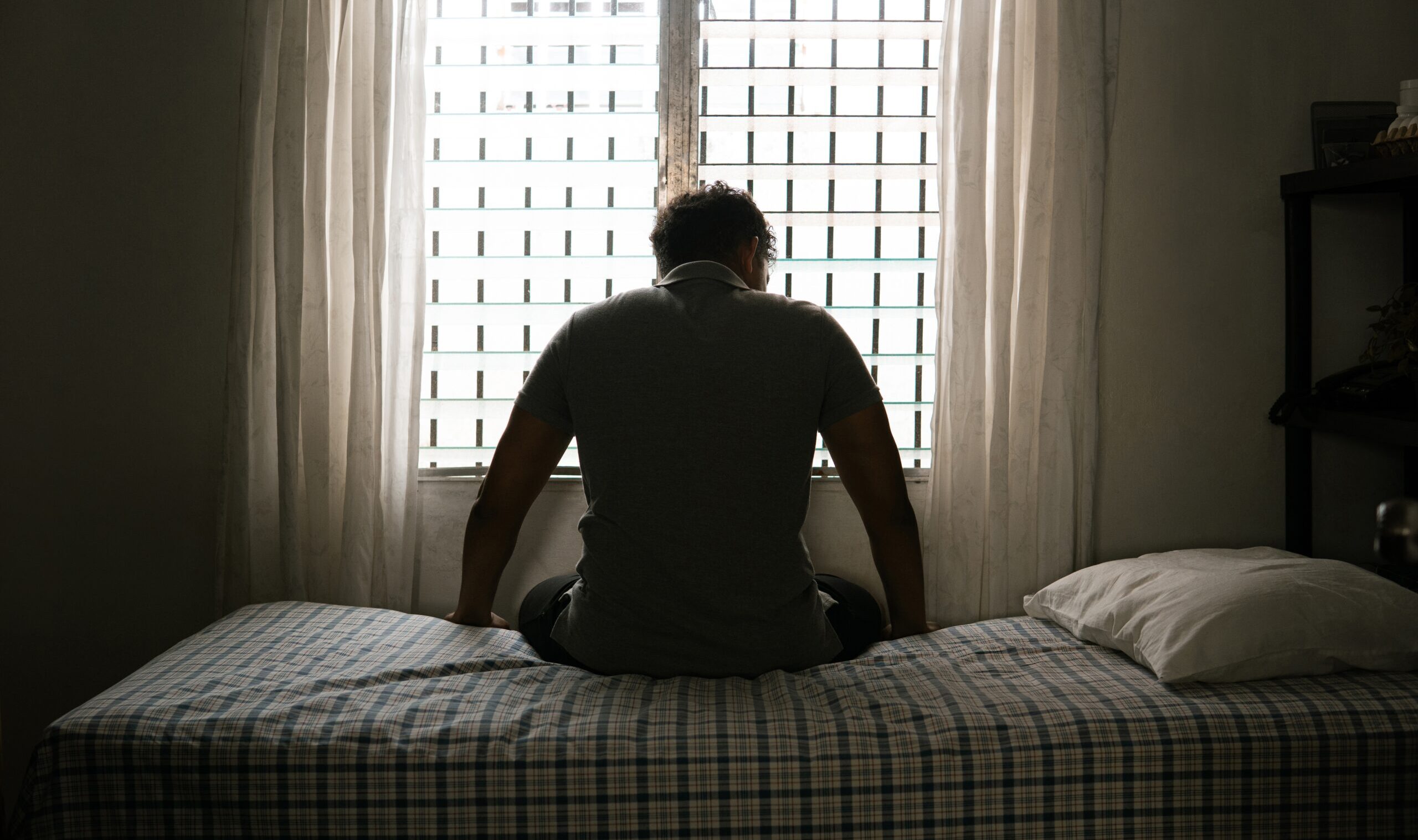 Desperate,Man,In,Silhouette,Sitting,On,The,Bed,Alone.,Masculinity