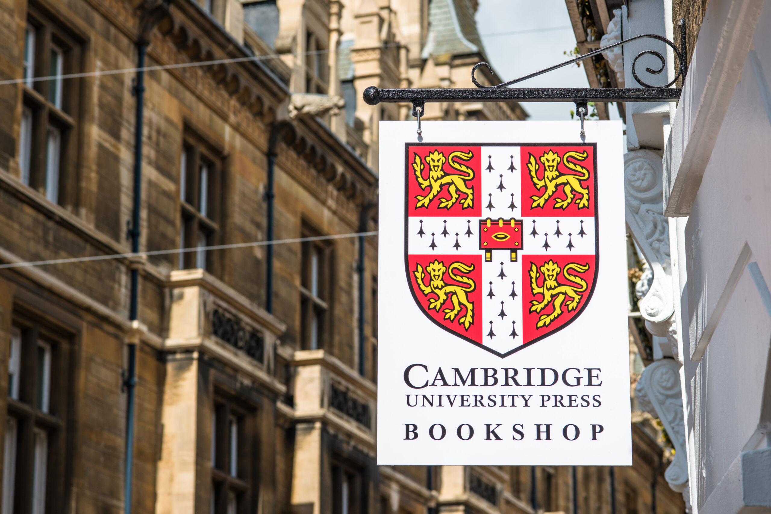 Cambridge University Press bookshop signpost off Market Square in Cambridge city center, Cambridgeshire, England, UK